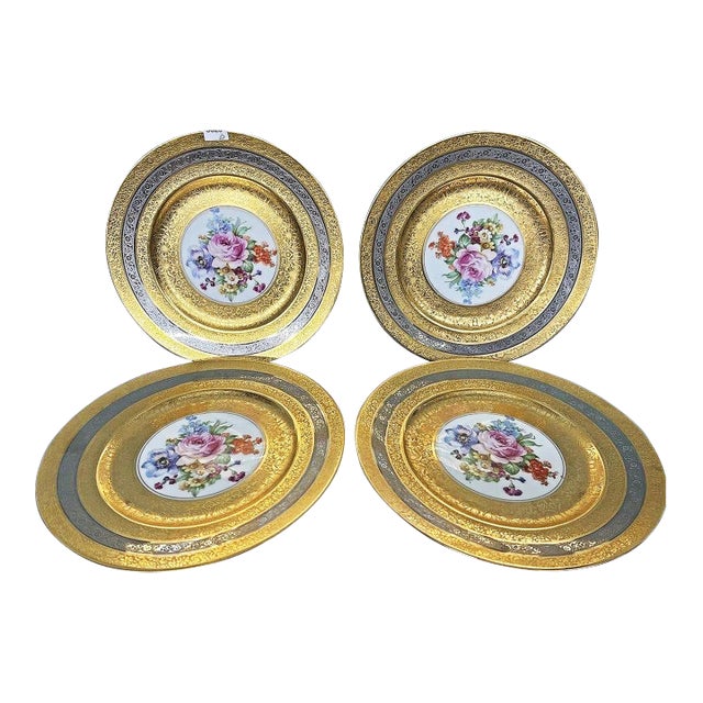 Stun them with this stunning floral-decorated porcelain chargers intricately decorated in 23-karat gold and silver motif....