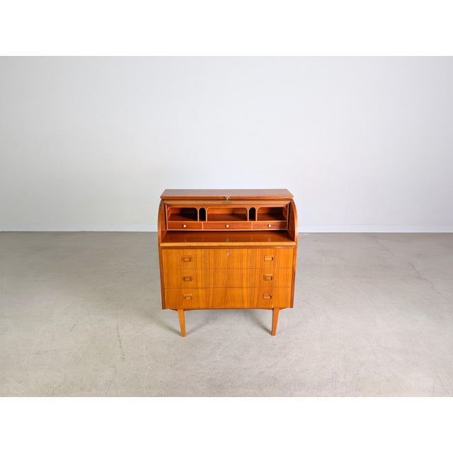 We are offering a beautiful vintage teak secretary desk from the 1960s for sale. The desk was designed by Egon Ostergaard...