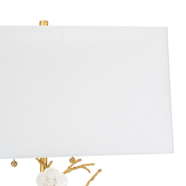 Cast metal branches, white porcelain flowers, and a luxe gold finish, gives the Cherise a perfect blend of balance and...
