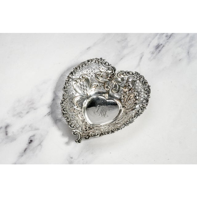 This exquisite antique Gorham sterling silver catchall dish is a beautifully crafted example of American silverwork,...