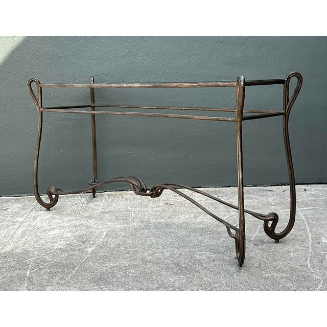 Embrace the fluid elegance of the Art Nouveau movement with this stunning vintage forged metal console table. Its hand-...