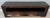 Chunky framed rectangular frame design, a dark tobacco stained finish, a wide open media shelf, and two bottom storage...