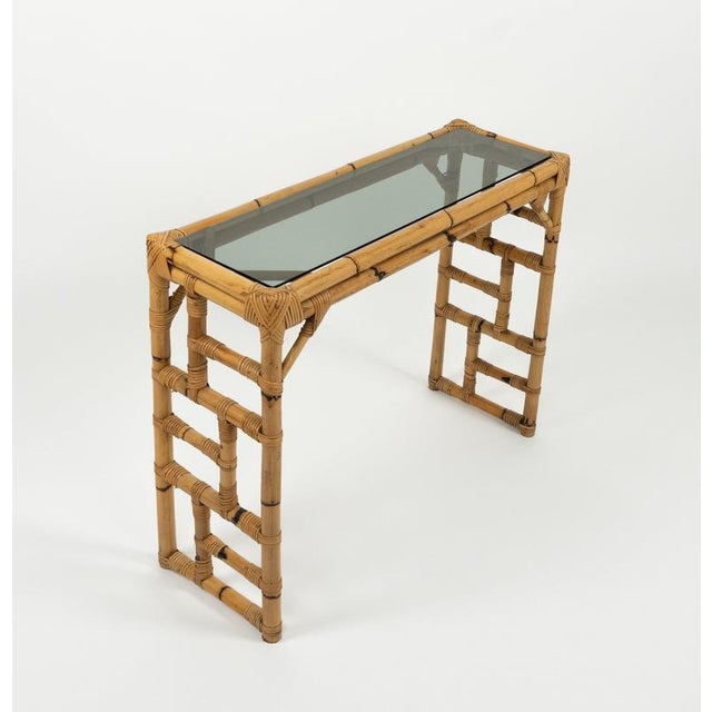 Mid-century beautiful rectangular geometric console table in bamboo, rattan and smoked glass by Vivai Del Sud. Made in...