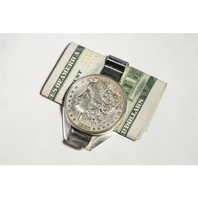 Make a powerful impression with this bold and beautifully crafted antique sterling silver money clip, featuring an...