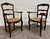 This is a gorgeous pair of antique French Country / Louis XV–style ladder back rush seat armchairs crafted in solid oak,...