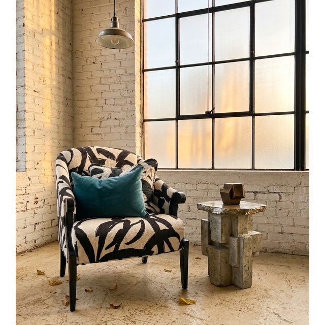 A striking statement piece that beautifully pairs mid-century heritage with contemporary edge. This authentic Thayer...