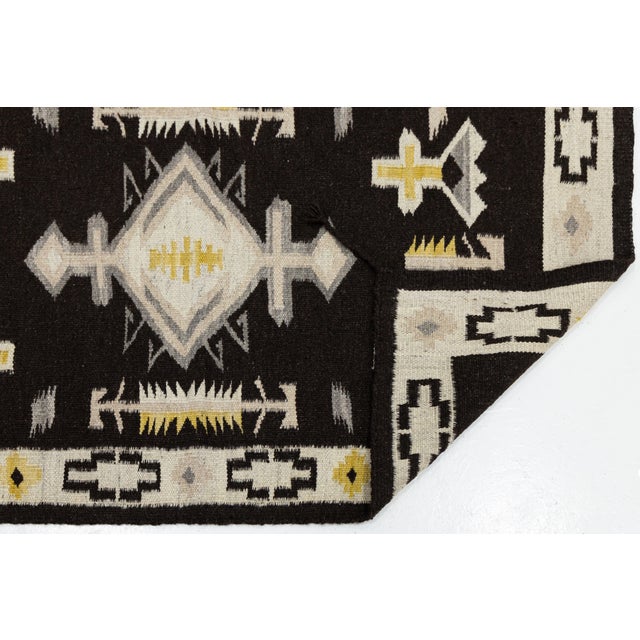 Elevate your space with this striking Modern Navajo Style Hand-Woven Wool Rug, perfectly tailored for high-end interiors...