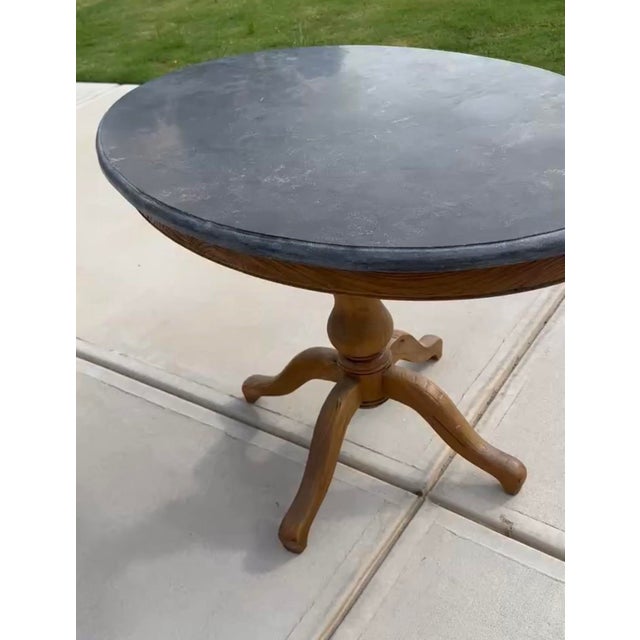 Gorgeous solid stone top on curved solid oak base. Beautifully maintained. Heirloom quality.