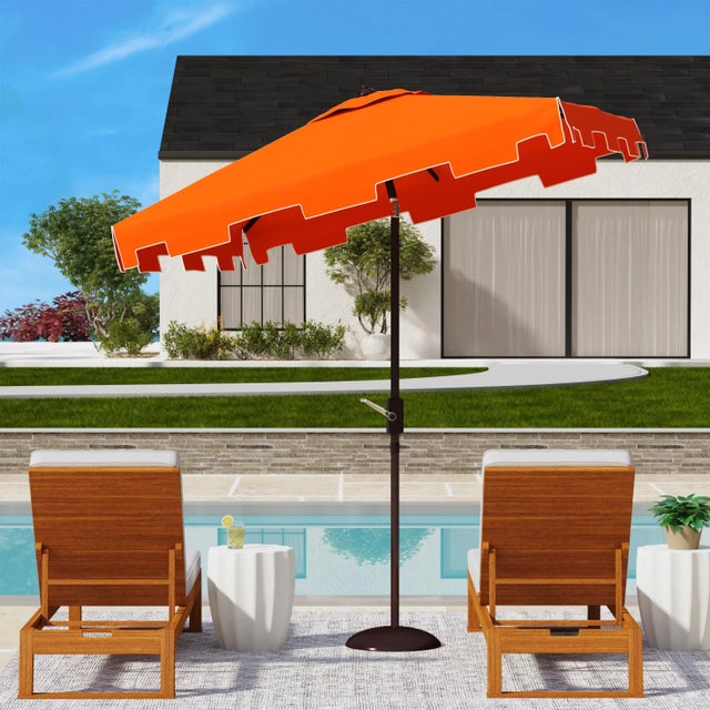 A classic market umbrella gets a chic makeover in orange and white with a stylish valance for extra sun protection and...