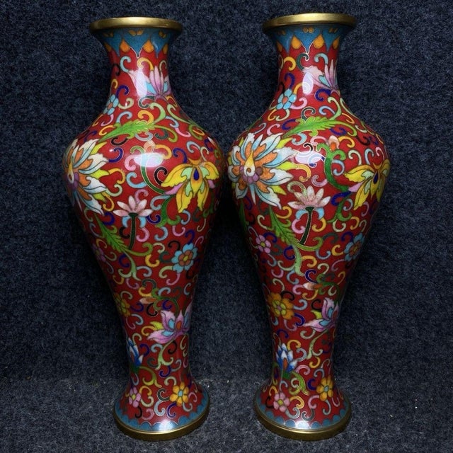 This is a vibrant and exquisitely crafted pair of matching cloisonné enamel vases, presented in a custom-fitted...