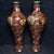 This is a vibrant and exquisitely crafted pair of matching cloisonné enamel vases, presented in a custom-fitted...