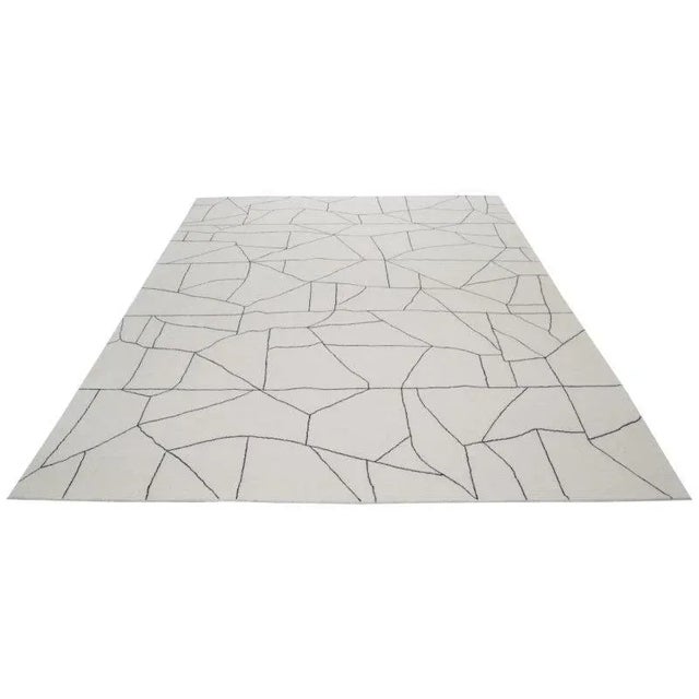 Moroccan Hand-knotted with care using traditional rug-making techniques, this wool rug blends timeless craftsmanship with...