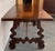 A monumental 20th century Spanish trestle table, having a rectangular framed solid walnut inset board top, resting on hand...