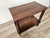 An elegant Italian Art Deco coffee table, crafted in walnut in the 1950s with a geometric, well-proportioned frame. The...