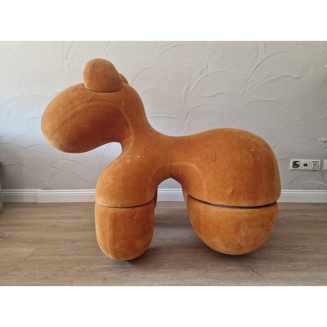 One of the very rare pony chairs from the first production in 1973, the chair still has its original cover material in...