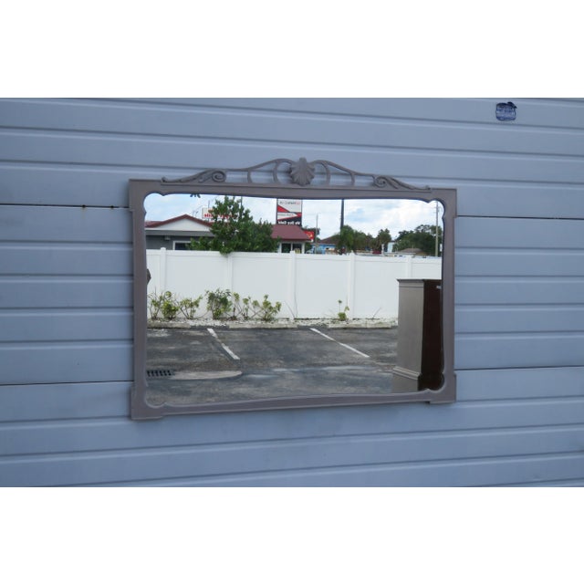 This classic Mirror is made of wood and glass, and is in good condition. This Mirror has a beautiful Traditional design;...