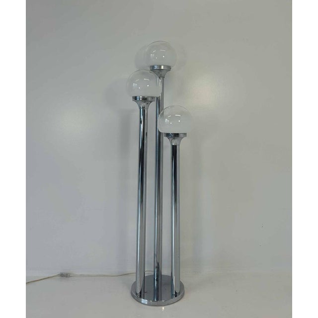 Floor lamp attributed to Mazzega, produced in Italy in the 1970s. Chrome structure and spherical Murano glass lampshades....