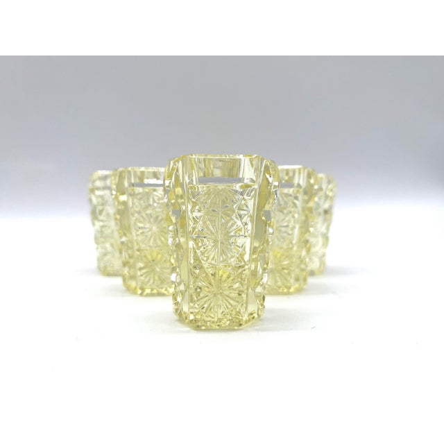 Set of six antique Bohemian shot glasses, crafted from yellow, transparent lead crystal. The glasses feature a simple,...