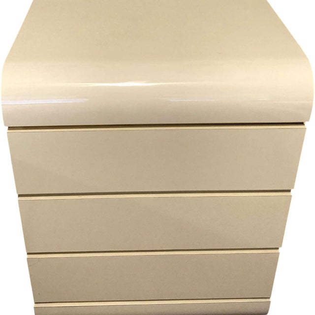 Elevate your space with a vintage 1980s laminated waterfall front design dresser with smooth metal glides and stops, and...