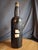 **This is an empty, secondary-market display piece.** This hand-blown vessel exhibits the heavy, dark-tinted glass and...