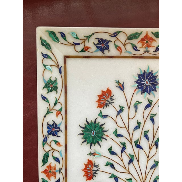 A beautiful traditional stone platter, inlaid with a variety of hand shaped stones traced in brass. The platter features a...