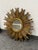 Design Plus Gallery presents a Wood Sunburst Mirror from Creative Co-Op. This round mirror has a layered radial frame in a...