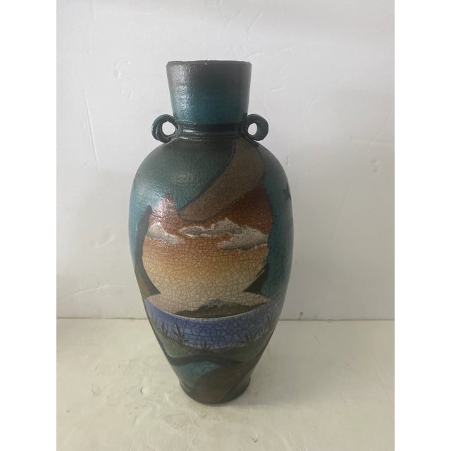 Beautiful southwest style ceramic vase by Ken Jensen signed on bottom. Has a great desert inspired landscape design which...