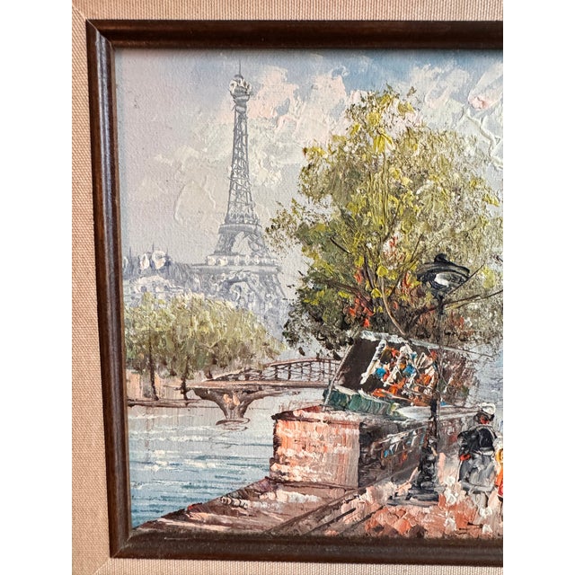 1960s street scene of Seine River street scene of Parisian life. Eiffel Tower Making an appearance in the background....