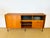 Vintage Scandinavian teak sideboard dating from the 1960s. Features a sliding door, a hinged door, and ample storage....