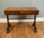 A handsome Regency walnut writing table dating to around 1820, combining elegant proportions with practical design The...