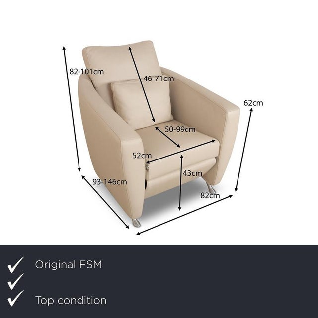 The Sesam armchair from FSM is covered in cream-colored genuine leather and stands on narrow metal feet. It is...