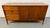 A timeless icon of American Mid-Century Modern design, this Barney Flagg for Drexel "Parallel" walnut credenza showcases...