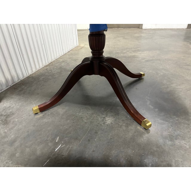 A vintage 1990s Georgian Vintage Banded 54" Mahogany Dining Table by Councill. This is a luxury American-made piece...
