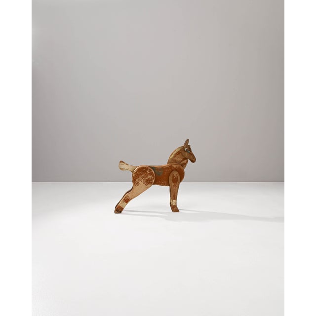 Discover a slice of history with this 20th Century French Wooden Horse, a handcrafted piece that exudes timeless charm and...