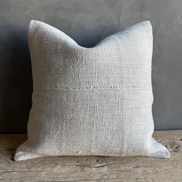 Creamy white hemp rug pillow with original seams. Soft hand, linen blend backing with zipper closure. Spot cleaning is...
