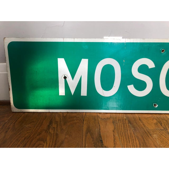 Vintage Moscow NY highway road sign. Reflective material on plywood board, four holes drilled from previous mounting.