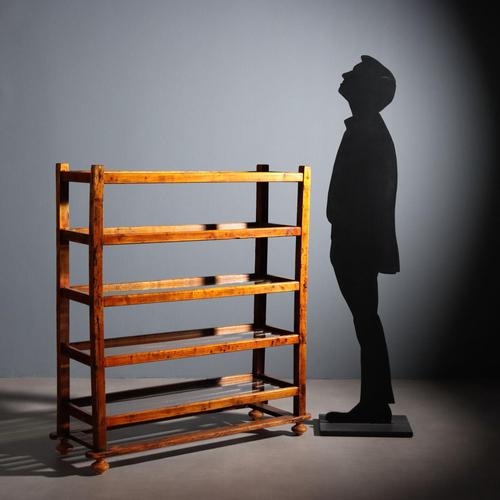 Bookcase in cherry-stained poplar and fir. Glass shelves resting on fir crosspieces, turned legs. Italy, early 20th...