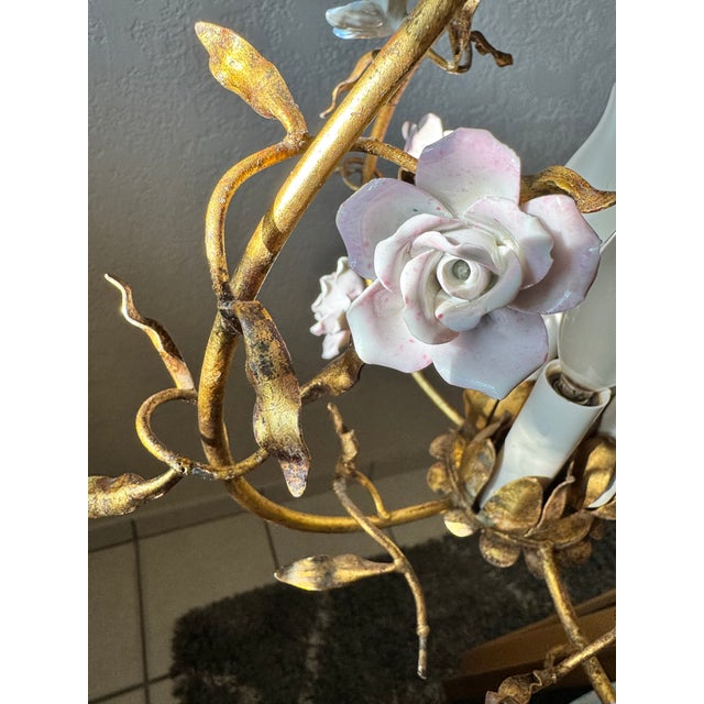 Italian Tole Chandelier with Polychrome Porcelain Flowers A beautiful handmade Italian chandelier is adorned with...