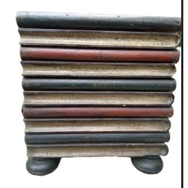 A late 19th century side table painted to look like a faux stacked book box — a whimsical, one-of-a-kind piece. Charming...