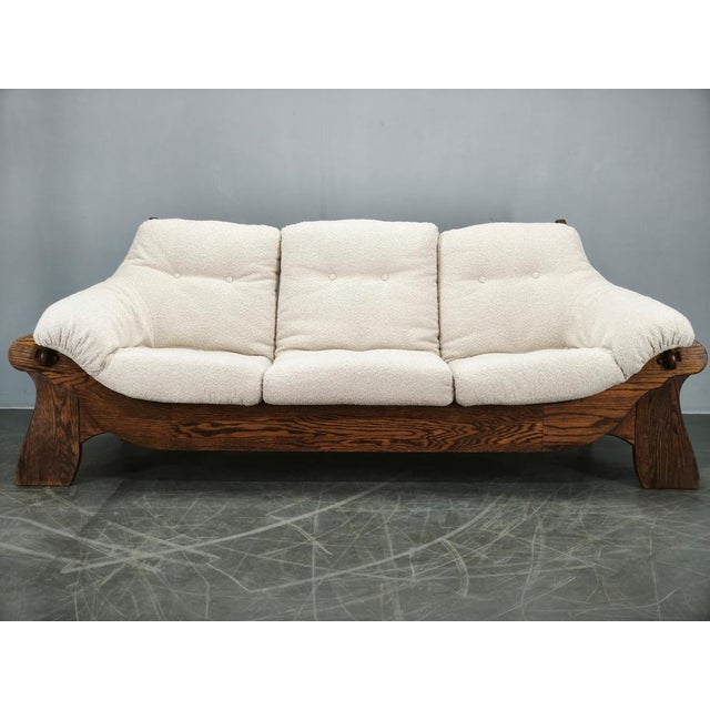 Rare Brutalist three-seat sofa crafted in solid oak and produced in Czechoslovakia during the 1970s. Distinguished by its...
