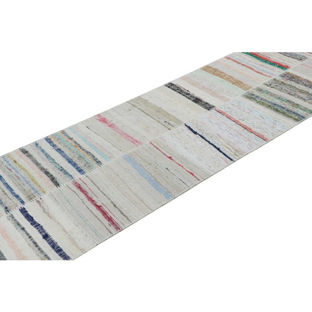 Hand woven in a wool flat weave utilizing vintage yarns, this modern Kilim rug from Rug & Kilim’s Patchwork Kilim rug...