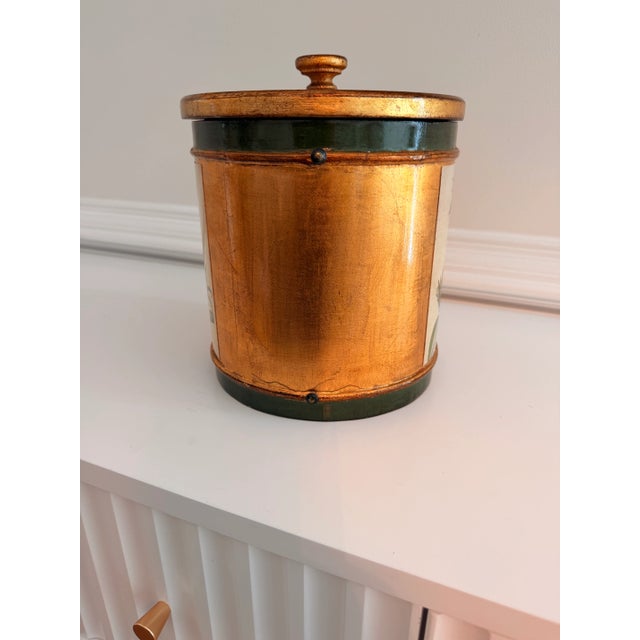 Vintage Vietri pineapple motif lidded ice bucket featuring a hand-decorated gilt finish with deep green banding and...