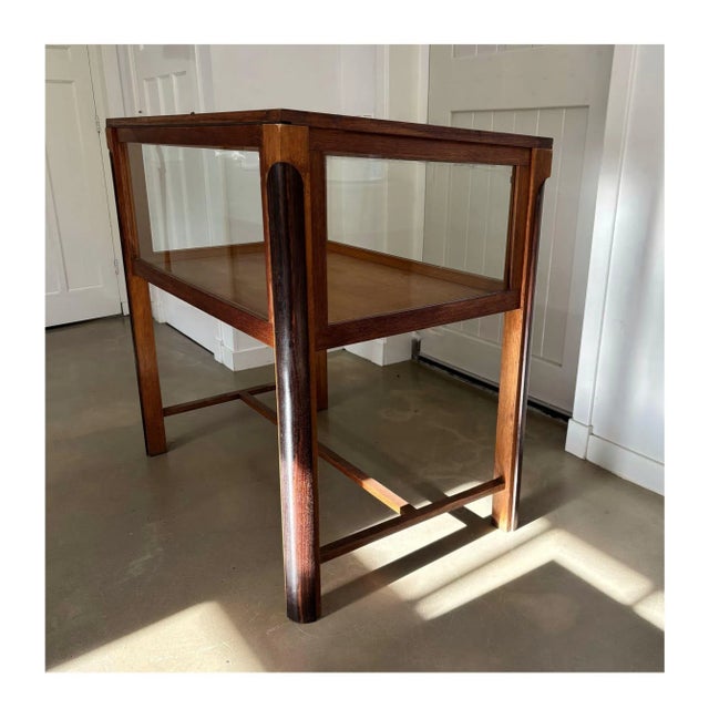 Impressive show cabinet made of two wood types and glass, originating from an Dutch museum. Originating from the 1930s...