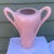 A fantastic artisan made two-handled sculptural ceramic vase fired in a pink crackle glaze finish by the California...
