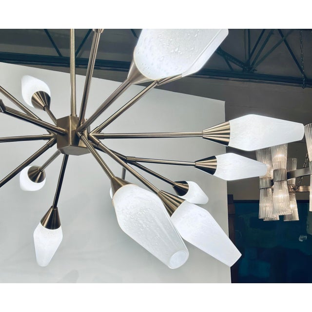 Original retail $3750, timeless Revelation Mid-Century Modern Style Agapanthus Chandelier, 18 white seeded glass shades...