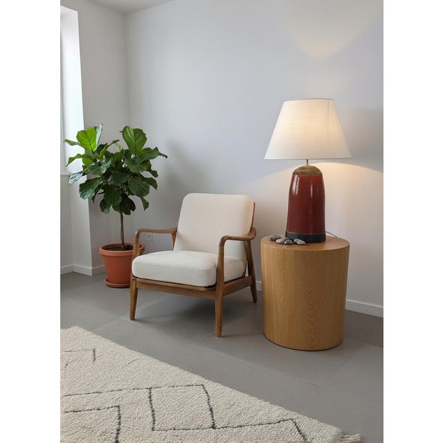 This table lamp embodies a vintage, handcrafted aesthetic, combining the warmth of fired clay (terracotta) with the...