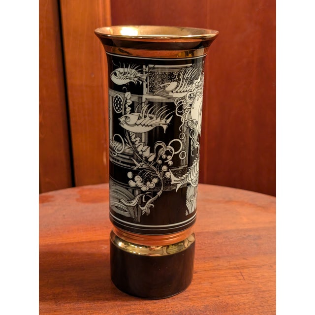 Gorgeous vase depicting an underwater goddess and fish. Features black, gold and white.