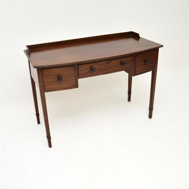 A smart and very useful antique Edwardian desk / writing table. This was made in England, it dates from around the...