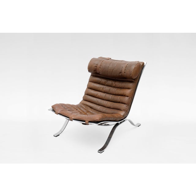 The Ari Chair by Arne Norell is a stunning example of Scandinavian Modern design, combining luxury with effortless...