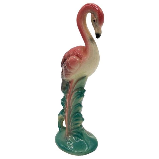 Mid-century pink and green long-legged "Gazer" flamingo ceramic figurine. The statue detailed a pink flamingo with long...